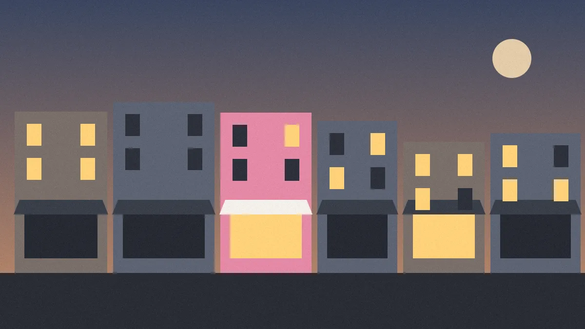 Flat illustration of a row of small shopfronts at dusk, with a pink café and one other window lit warmly